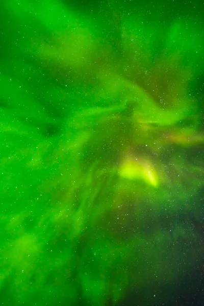 Beautiful northern lights aurora borealis against the background of the starry sky. — Stock Photo, Image