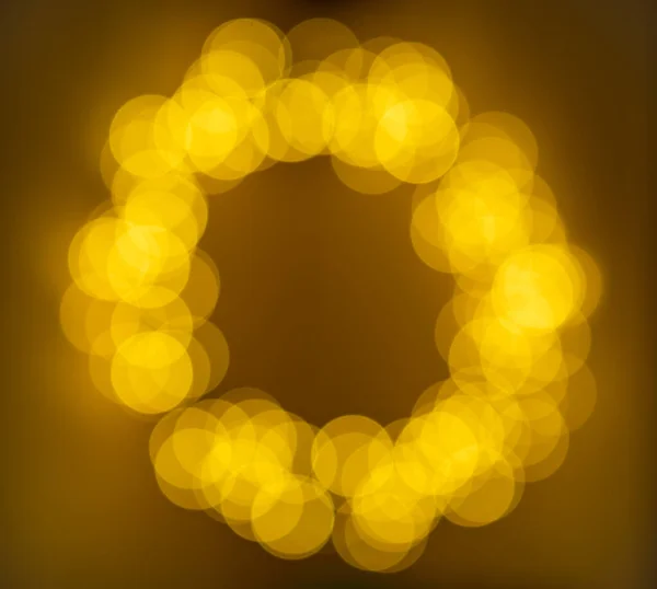 Blurred abstract pattern - circle light photo background. The abstract bokeh background, yellow lights background
