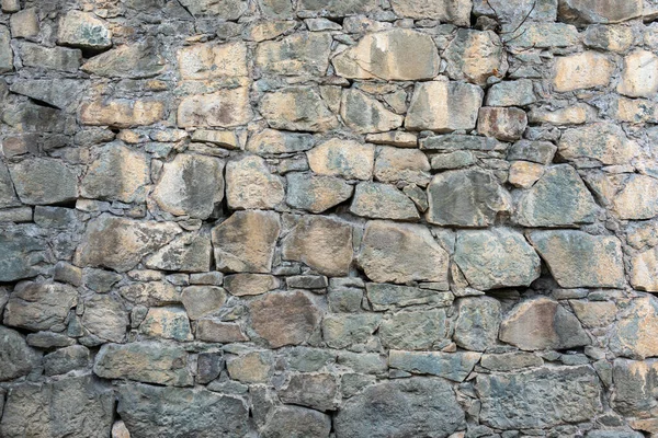 Backgrounds of the old fortress wall. Ancient historic Genoese castle or fortress