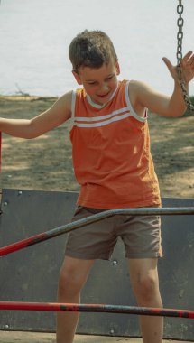 the child is riding a swing         