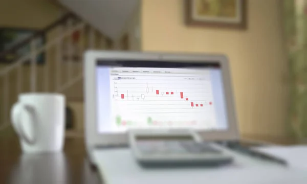 Candlestick chart on computer screen. Selective focus. Stock trading at home concept.