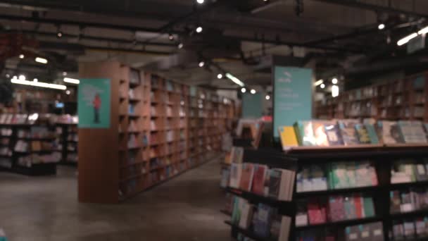 Defocused Book Store Shoppers Walking — Stock Video