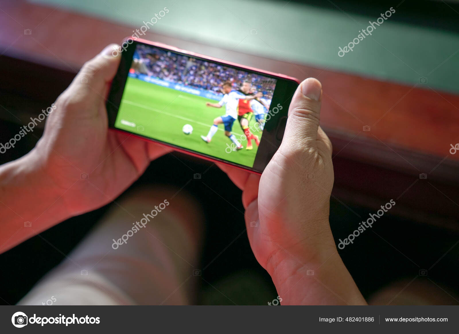 Man Watching Football Sport Stream Mobile Phone Close View Home Stock Photo by ©sinseeho 482401886