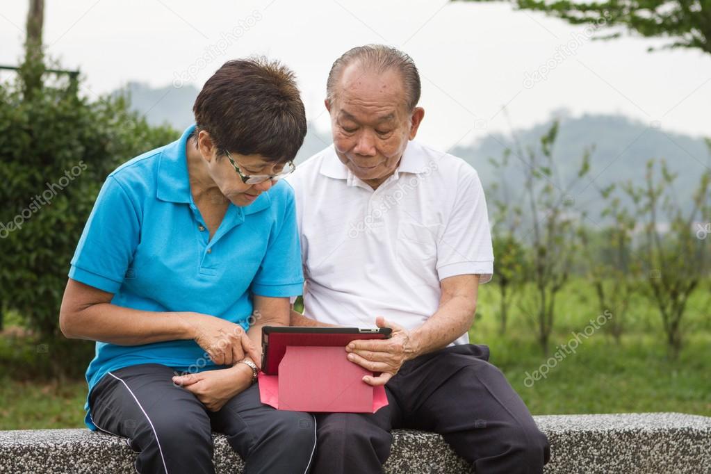 Senior couple on computer tablet