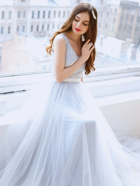Bride in a tender light blue wedding dress in a morning. Fashion beauty portrait — Stock Photo, Image