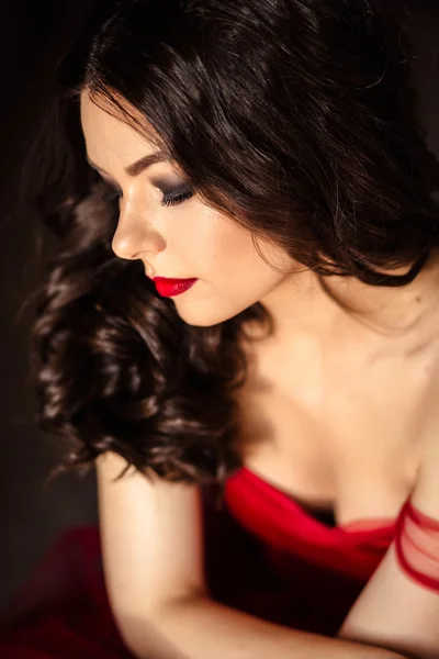 Portrait of sensual woman in a long gorgeous red dress — Stock Photo, Image