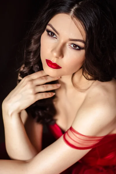 Portrait of sensual woman in a long gorgeous red dress — Stock Photo, Image