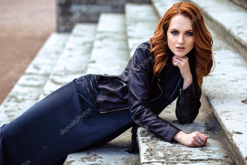 fashion street photo session of stylish young lady in a black clothes