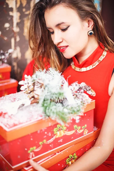 Portrait of beautiful sweet young woman in gorgeous evening dress over Christmas background. — Stock Photo, Image