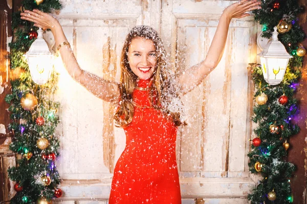 Portrait of beautiful sweet young woman in gorgeous evening dress over Christmas background. — Stock Photo, Image