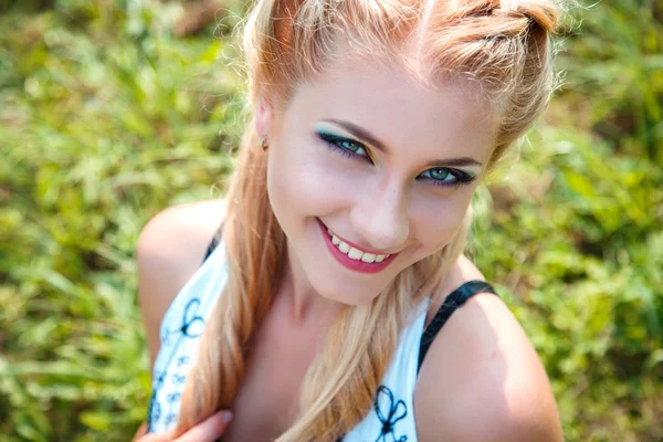 Close-up portrait of sweet young pretty blonde girl with colored make-up. Summer, outside — Stock Photo, Image