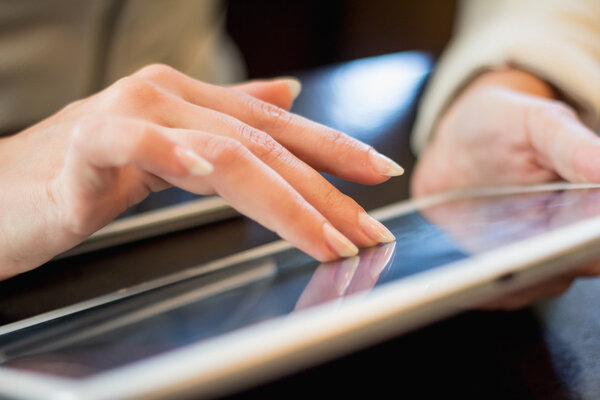 woman works on the digital tablet, soft focus, close up