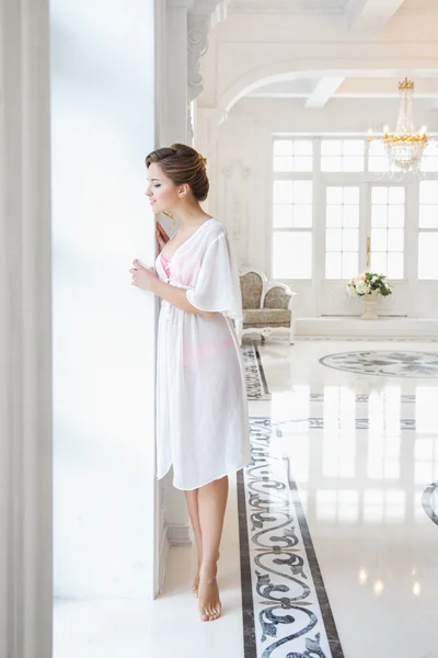 Beautiful bride in white lingerie in gorgeous interior in a morning — Stock Photo, Image