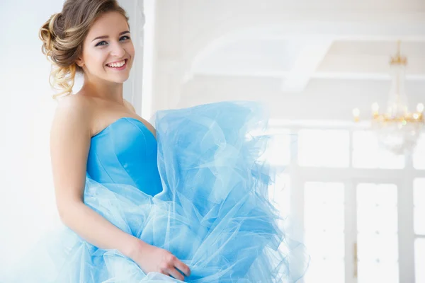 Beautiful bride in gorgeous blue dress Cinderella style in a morning — Stock Photo, Image