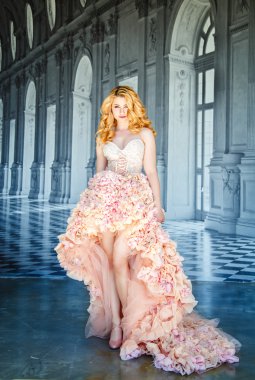 portrait of a beautiful blonde bride in a luxurious wedding dress in elegant expensive interior