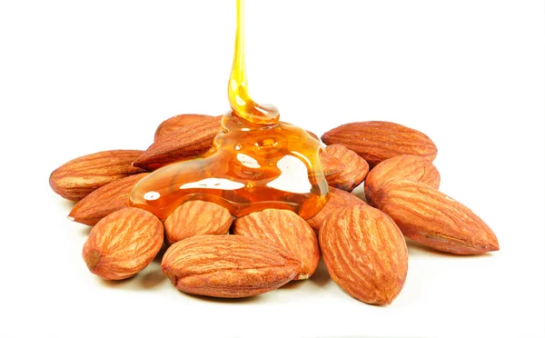 Almond nuts and honey — Stock Photo, Image