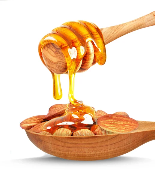 Almond nuts and honey — Stock Photo, Image