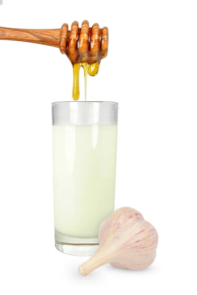 Чеснок с молоком и медом — стоковое фото