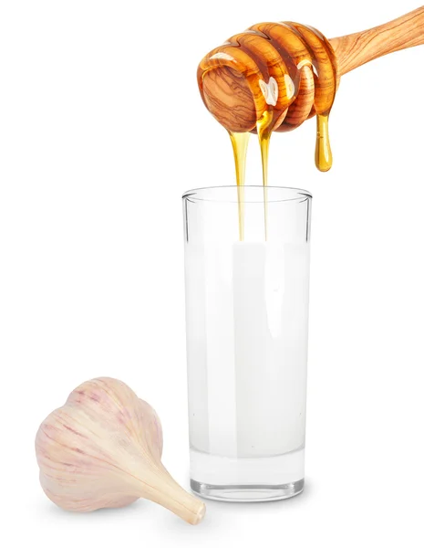 Молоко с медом и чесноком — стоковое фото