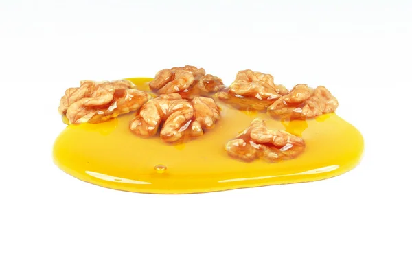 Walnuts and honey — Stock Photo, Image