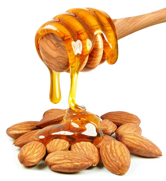 Almond nuts and honey — Stock Photo, Image