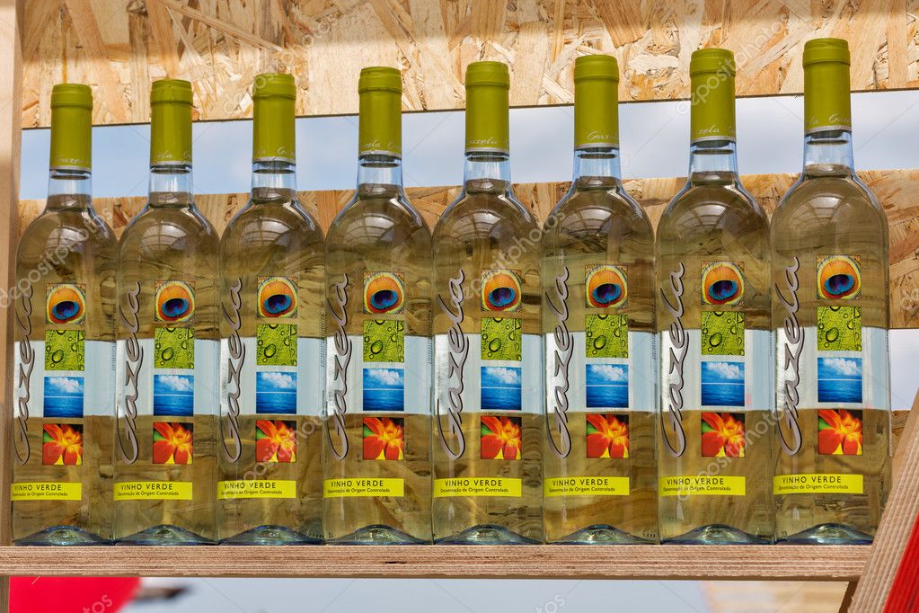 KIEV, UKRAINE - June 04, 2016: Gazela Portugal wine bottles in a row presented on wooden shelf of outdoor food court at Kyiv Wine Festival organized by Good Wine company in Parkovy Exhibition Center.