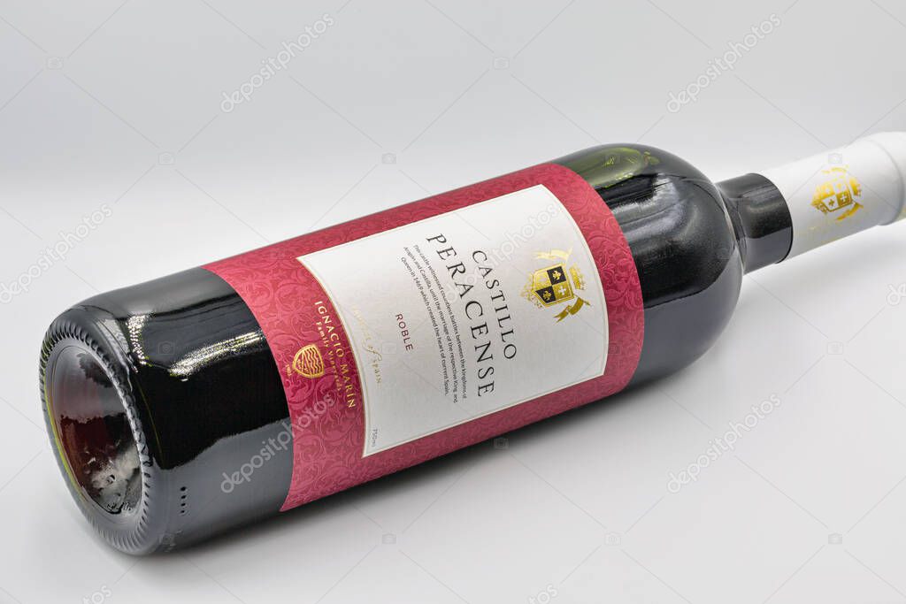 KYIV, UKRAINE - OCTOBER 14, 2020: Studio shoot of Castillo Peracense Ignacio Marin family vineyards Spanish red wine bottle closeup against white background.