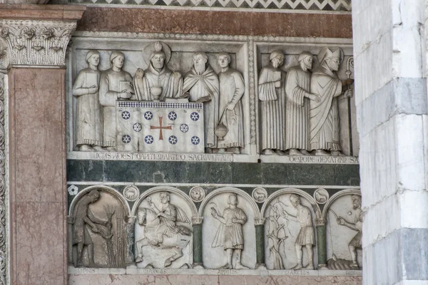 Bas relief on the Cathedral of St Martin wall, Lucca, Italy — Stock Photo, Image