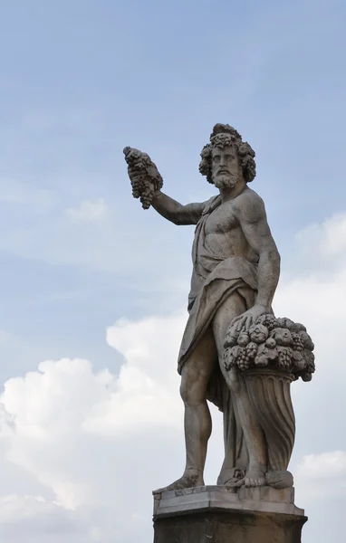 Statue of Autumn, or Bacchus in Holy Trinity Bridge, Florence — Stock Photo, Image