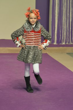 Little girl model at Kyiv Fashion 2014 clipart