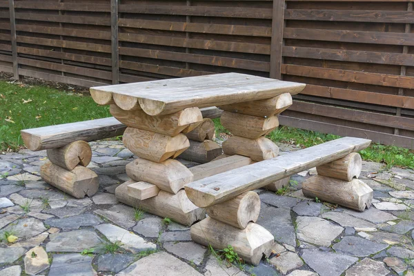 Made from wooden logs table and benches outdoor — Stock Photo, Image