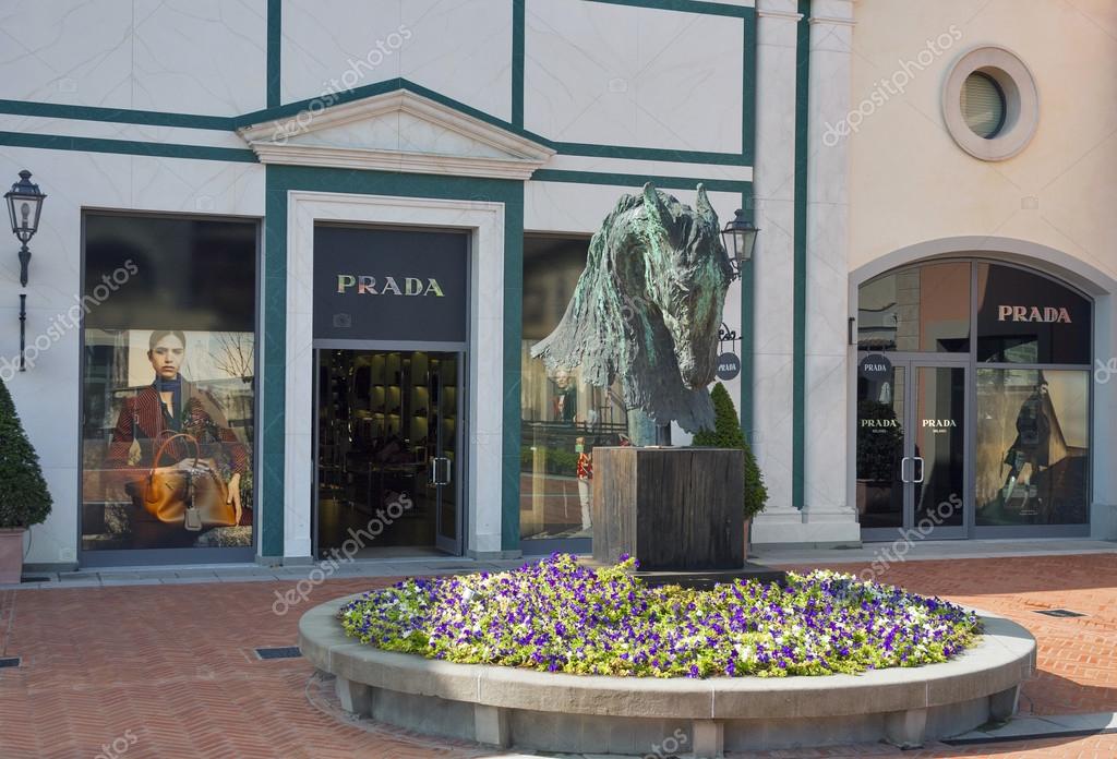 MUGELLO, ITALY - SEPTEMBER 11, 2014: Facade of Prada store in McArthurGlen Designer Outlet Barberino situated in 30 minutes from Florence. Prada is an Italian luxury fashion house, specializing in leather and fashion accessories, shoes