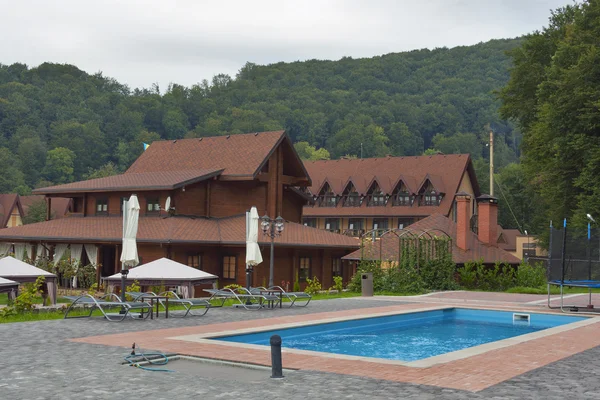 Tourustic complex with outdoor swimming pool in Carpathians — Stock Fotó