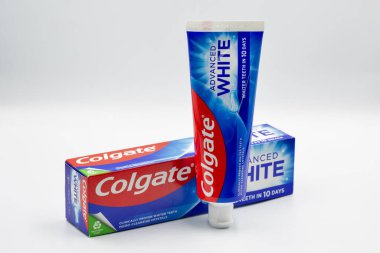Kyiv, Ukraine - December 1, 2024: Colgate fluoride Advanced White toothpaste pack ant tube closeup on white. Colgate is a manufacturer of a wide range of toothpastes, toothbrushes, and mouthwashes.