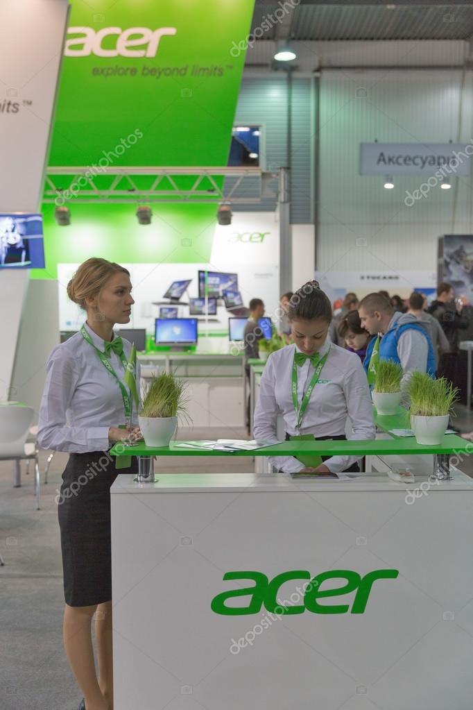 KIEV, UKRAINE - OCTOBER 11, 2015: Presenters work on Acer, a Taiwan based international computer company booth during CEE 2015, largest electronics trade show of Ukraine in ExpoPlaza Exhibition Center