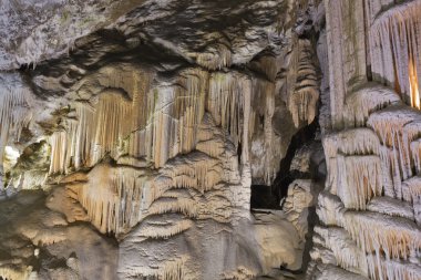 Cave inside with stalactites and stalagmites clipart