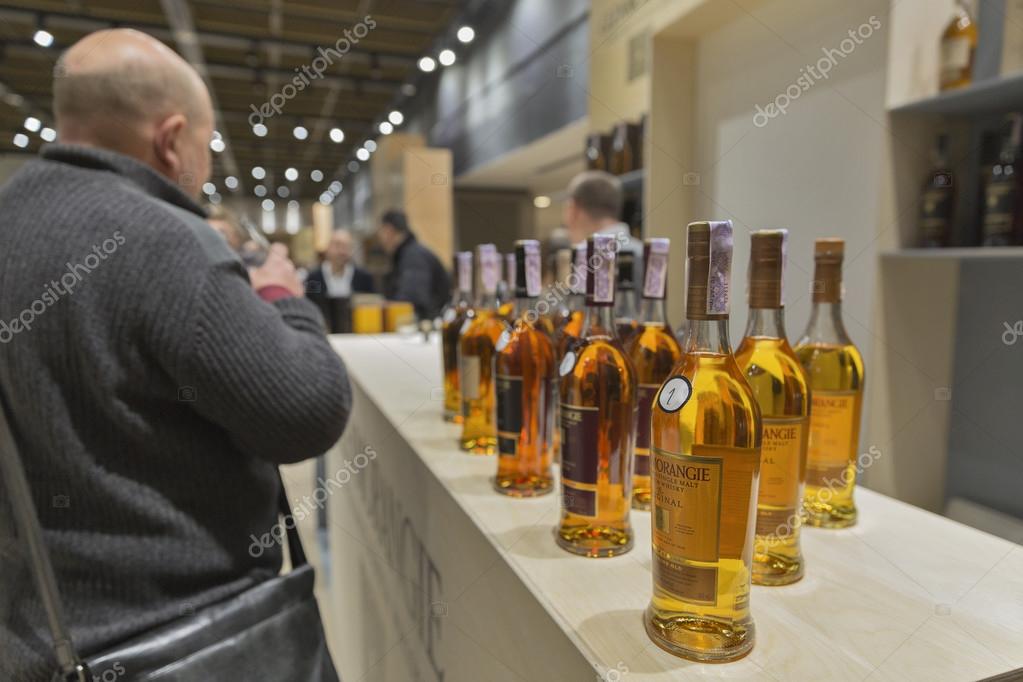KIEV, UKRAINE - NOVEMBER 21, 2015: Unrecognized people visit Glenmorangie Single Malt Scotch Whisky Highland distillery booth at 1st Ukrainian Whisky Dram Festival in Parkovy Exhibition Center.