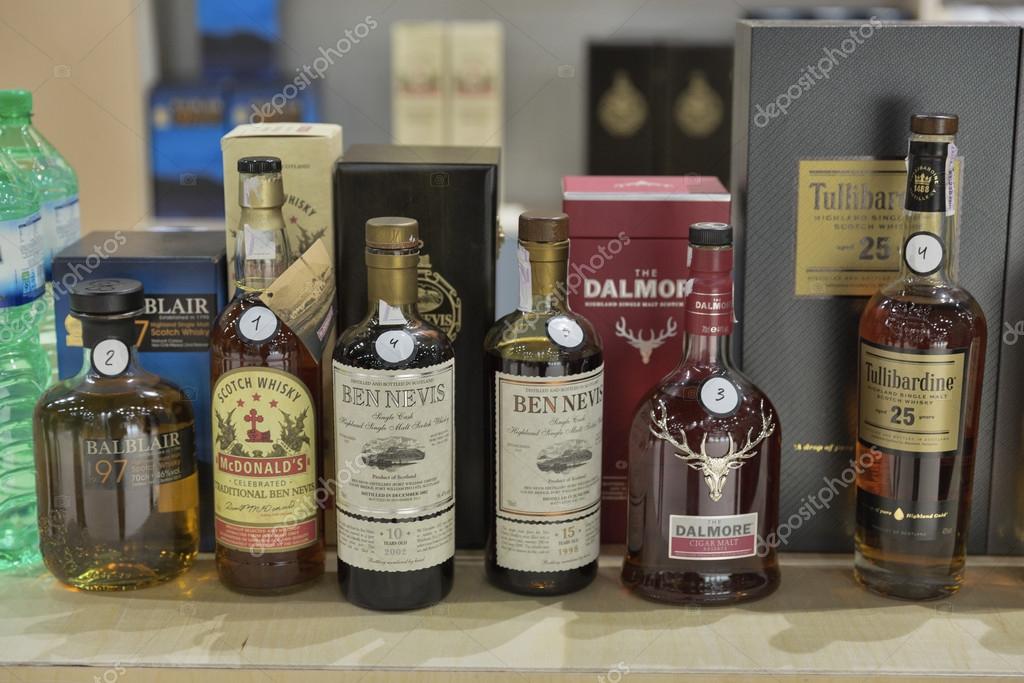 KIEV, UKRAINE - NOVEMBER 21, 2015: Different bottles of rare Highland and Speyside Single Malt Scotch Whiskey on display for tasting at 1st Ukrainian Whisky Dram Festival in Parkovy Exhibition Center.