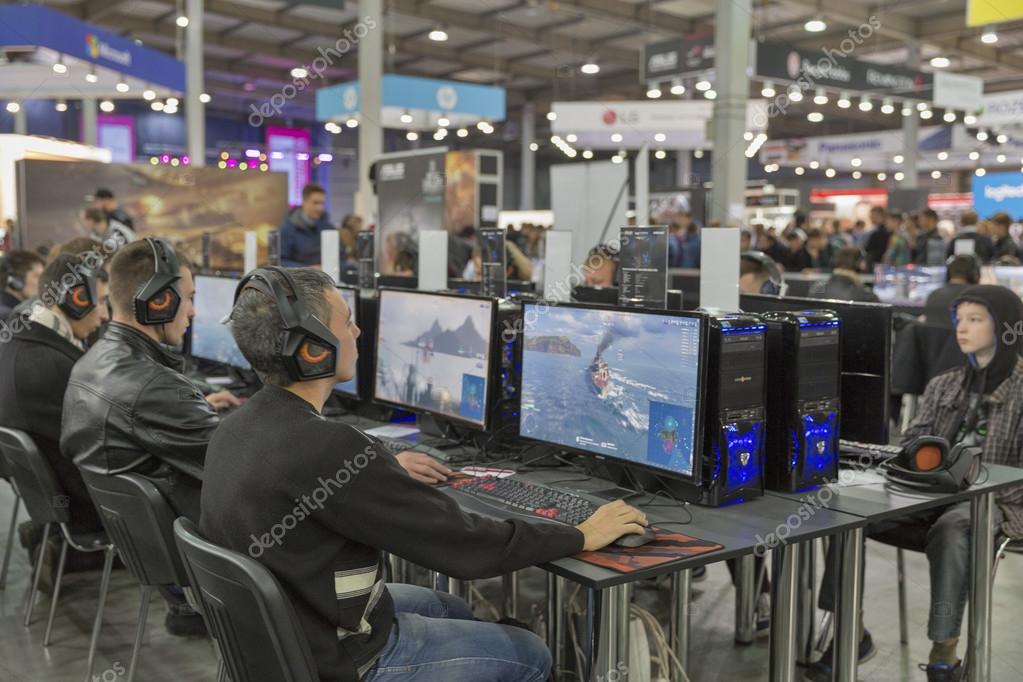KIEV, UKRAINE - OCTOBER 11, 2015: People visit Wargaming company computer game zone during CEE 2015, the largest electronics trade show of Ukraine in ExpoPlaza Exhibition Center