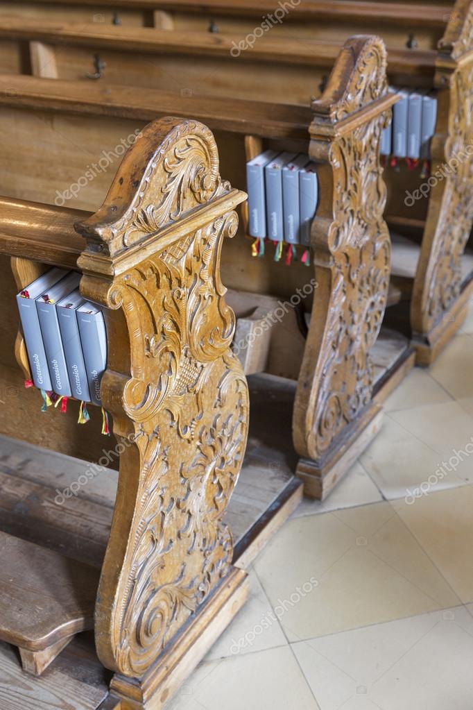 Wooden Benches With Gotteslob In Austrian Church Stock Photo
