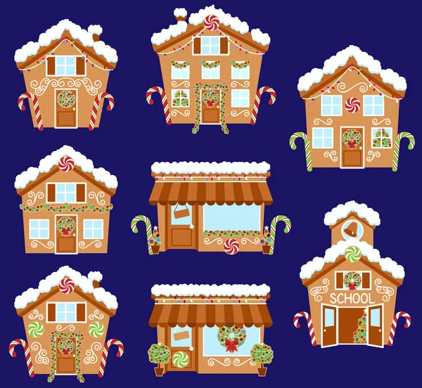 Ensemble de maisons, magasins et autres bâtiments en pain d'épice de vacances vectoriel mignon avec neige — Image vectorielle