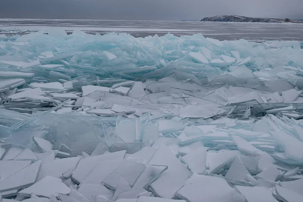 Cracked ice floes on the shore of Baikal. Beautiful landscape concept