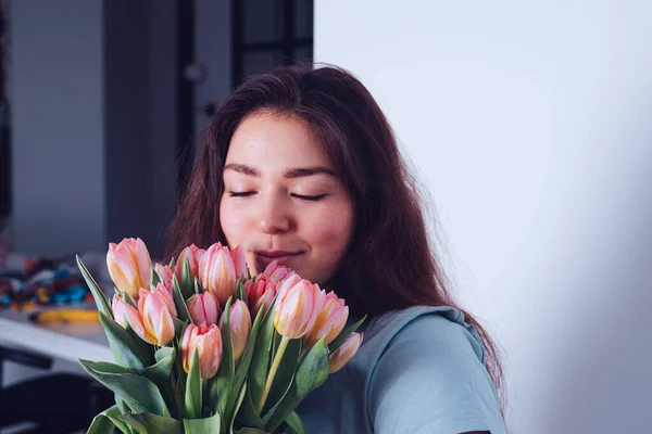 Happy Woman Pink Tulips Her Hand She Smiles Smells Flowers — Stock Photo, Image