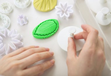 Artist makes jewelry from polymer clay, process. Workshop clipart