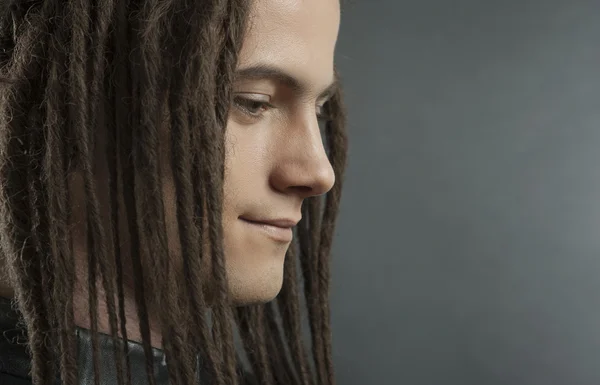 Young man's portrait. Stylish handsome sexy Guy with Dreadlocks — Stock Photo, Image