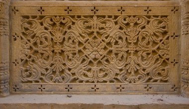 Jaisalmer (Hindistan) 'da duvarlara oyulmuş süs, Kum Kayası deseni, doğu tarzında dekoratif desen. Oyulmuş duvar dokusu, arkaplan