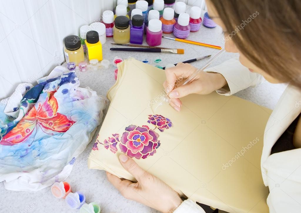 Batik process: artist paints on fabric, Batik painting
