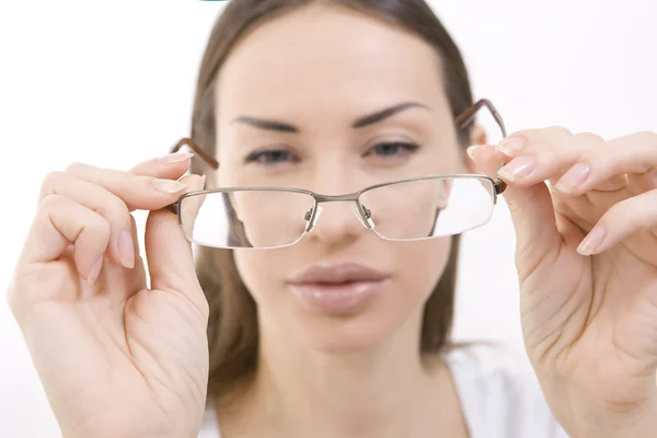 Optics and Glasses, Portrait of young woman looking through her — Stock Photo, Image