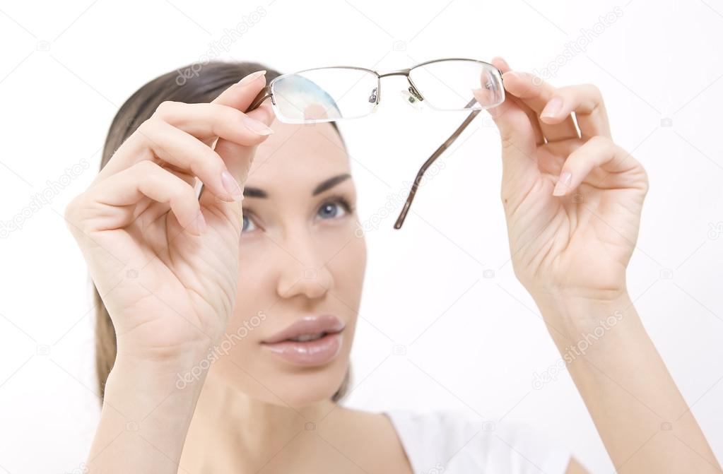 Optics and Glasses, Portrait of young smiling woman looking thro