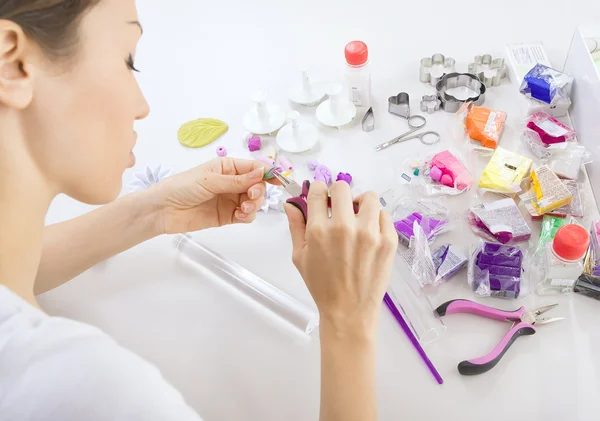 Artist makes jewelry from polymer clay, process. Workshop — Stock Photo, Image